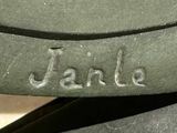 a close up of a bench with a name engraved on it