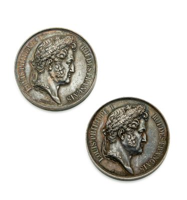 deux pièces d'argent sur lesquelles figure le visage d'une femme