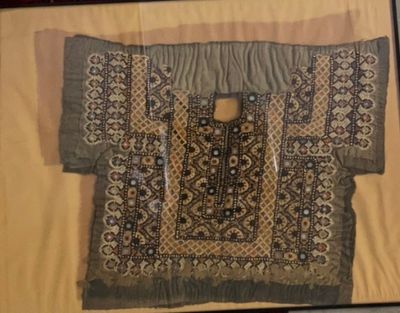a picture of a piece of cloth hanging on a wall