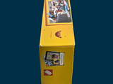 a yellow box with stickers on it sitting on a table