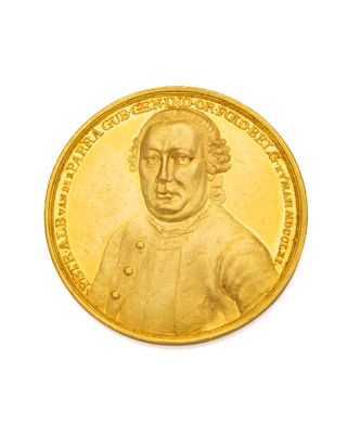l'image d'une pièce d'or sur laquelle figure le portrait d'un homme