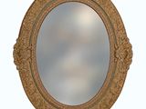 a round mirror with a gold frame on a white background