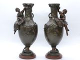 pair of antique bronze vases with cherenshes and cherenshes on them