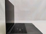 a laptop that is sitting on a white surface
