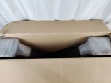 a cardboard box with a toilet in it and a roll of toilet paper in it