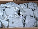 a cardboard box filled with lots of bags of luggage