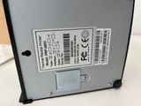 a close up of the back of a computer with a label on it