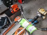 a bike that is sitting in a garage with other tools