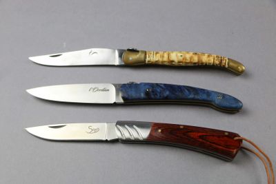 three different types of knives that are on a table
