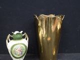 two vases sitting next to each other on a table