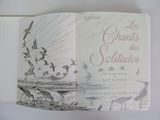 a book with a picture of birds flying in the sky