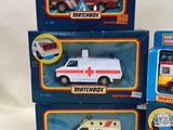 three toy ambulances are stacked on top of each other