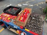 many tools on a cart in the parking lot