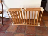 an image of a wooden magazine rack on a tiled floor