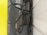 a yellow and black phone with a cord attached to it