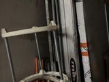 a stack of tools and a chair in a garage