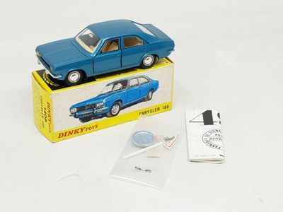 a blue toy car sitting on top of a box