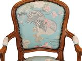 a blue chair with a rooster on the back of it