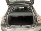 the back of a car with the trunk open and a mattress in the trunk