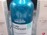 two bottles of l ' oreal scalp advanced sham and a box of soap