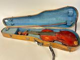 a violin in a case with a bow in it