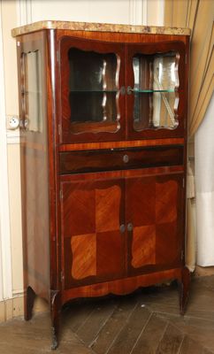 a wooden cabinet with a glass door on top of it