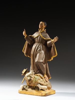 an image of a statue of a man standing on a rock