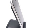 a cell phone that is sitting on top of a stand