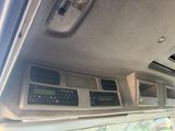 a dashboard of a car with various electronic controls