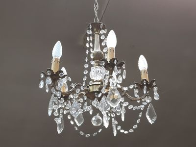 an image of a crystal chandelier hanging from a ceiling