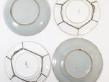 three plates are sitting on top of each other on a white surface