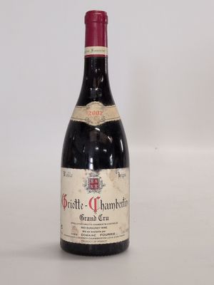 a bottle of wine that is sitting on a table