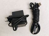 a charger and a cord on a white surface