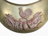 a gold collar with a rooster on top of it