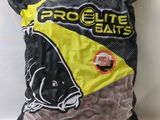 a bag of fish food sitting on top of a table