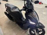 a scooter that is parked in a garage