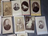 a lot of old photos of people on the table