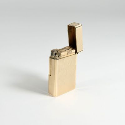 a lighter that is sitting on a white surface