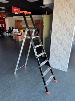 a ladder that is sitting in the middle of a room