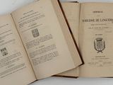 two open books that are sitting on a table