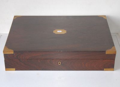 a small wooden box with a lid on a white surface