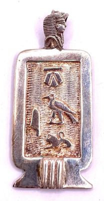 an image of a silver pendant with a bird and a bird on it