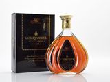 the bottle of courvoisir is next to the box