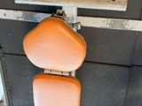 an orange seat on the back of a train
