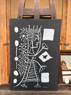 un tableau noir sur lequel est dessiné un homme