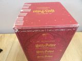 a red box that has a harry potter book on it