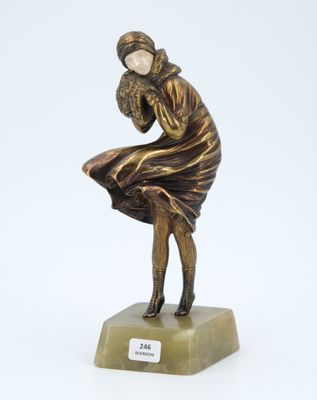 bronze statue of a woman sitting on a marble base