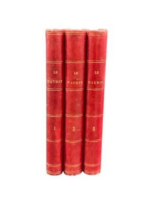 three red books sitting on top of each other on a white surface