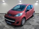 a picture of a small red car parked in a garage