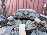 a close up of a motorcycle with a chain attached to it
